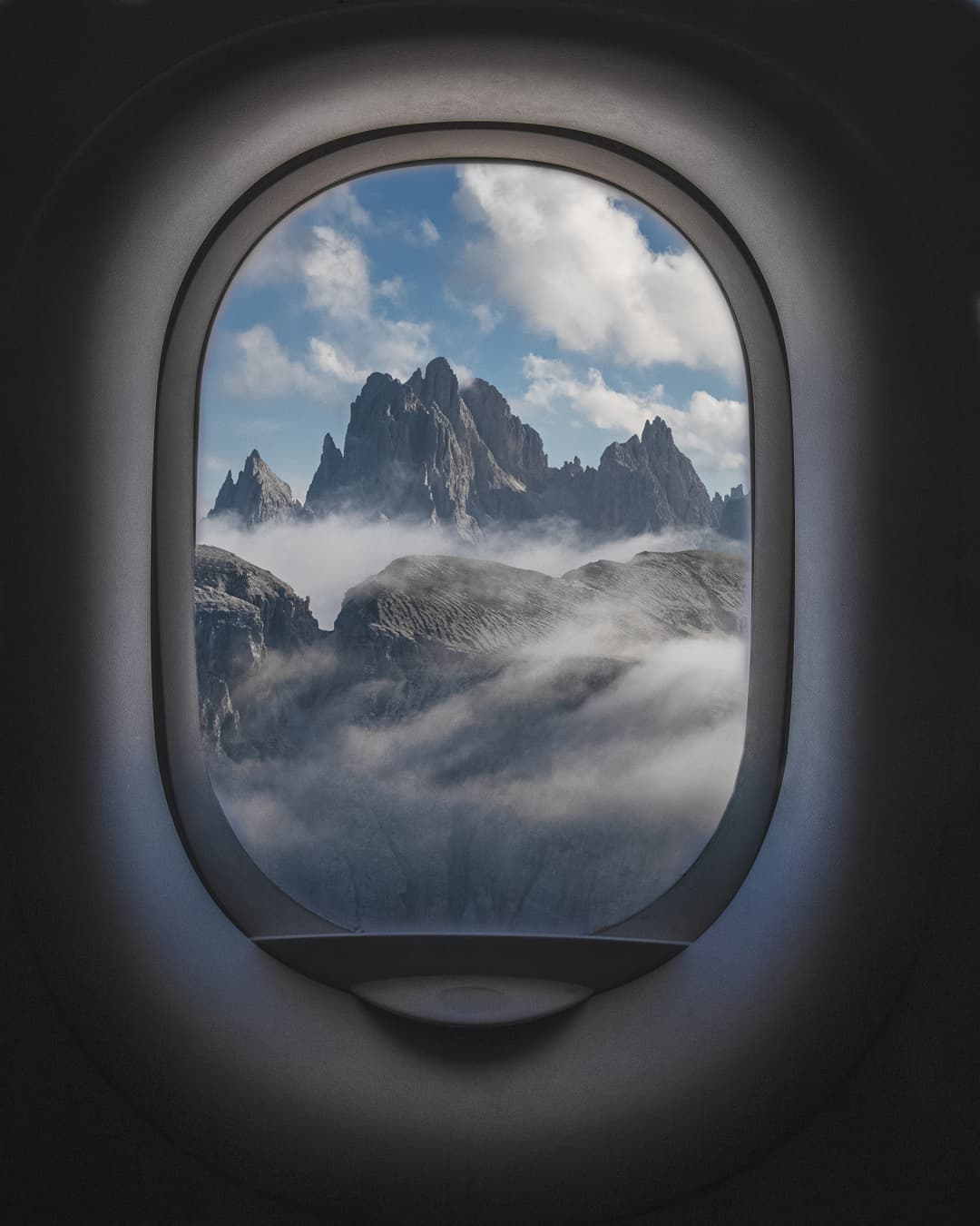 View of mountains through an airplane window